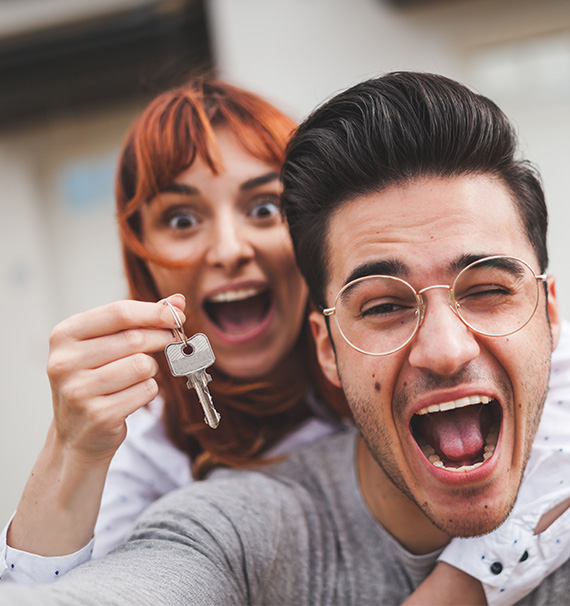 Couple holding key